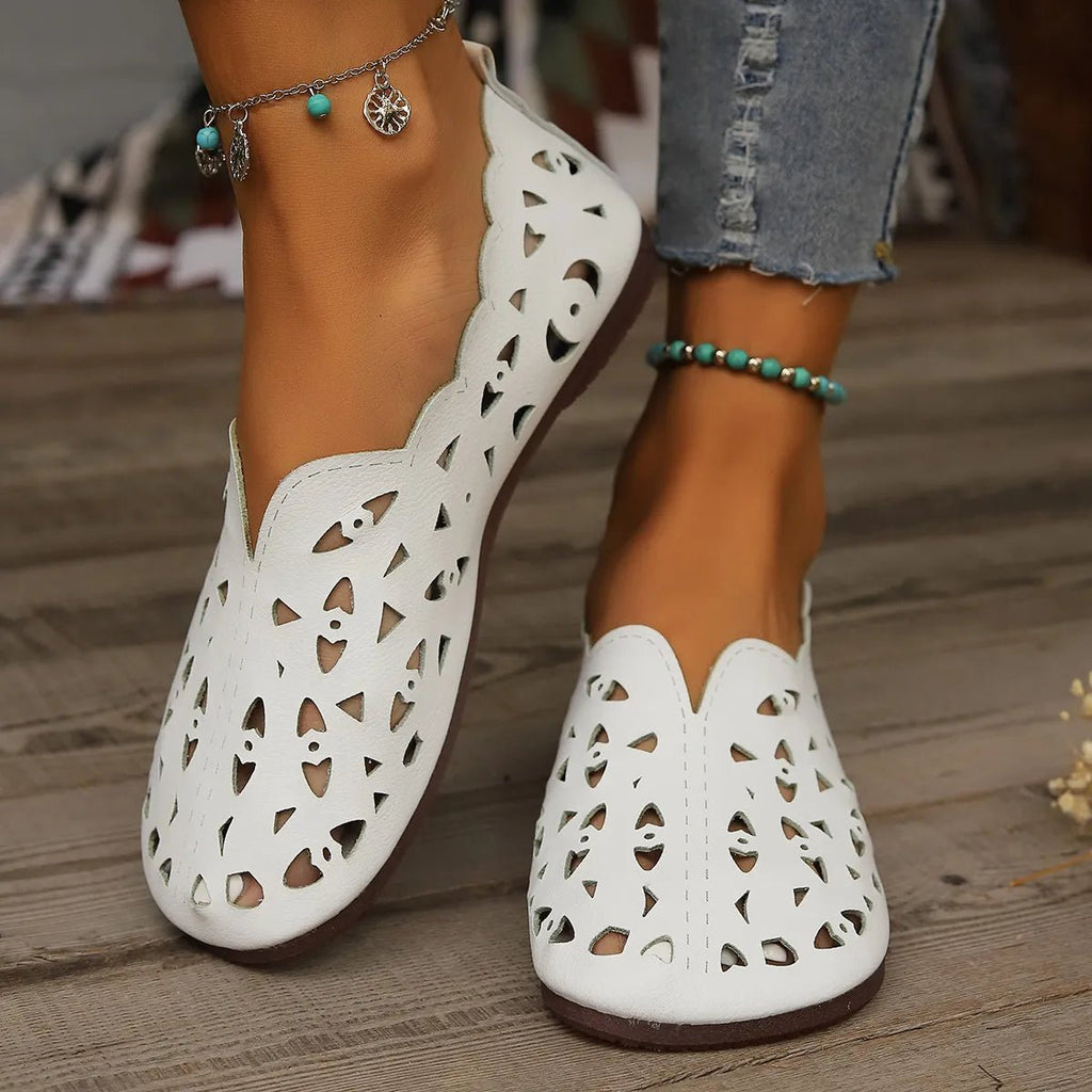 Women's hollow-out breathable casual flat slip-on shoes by Trendsi, featuring lightweight comfort and stylish open design.