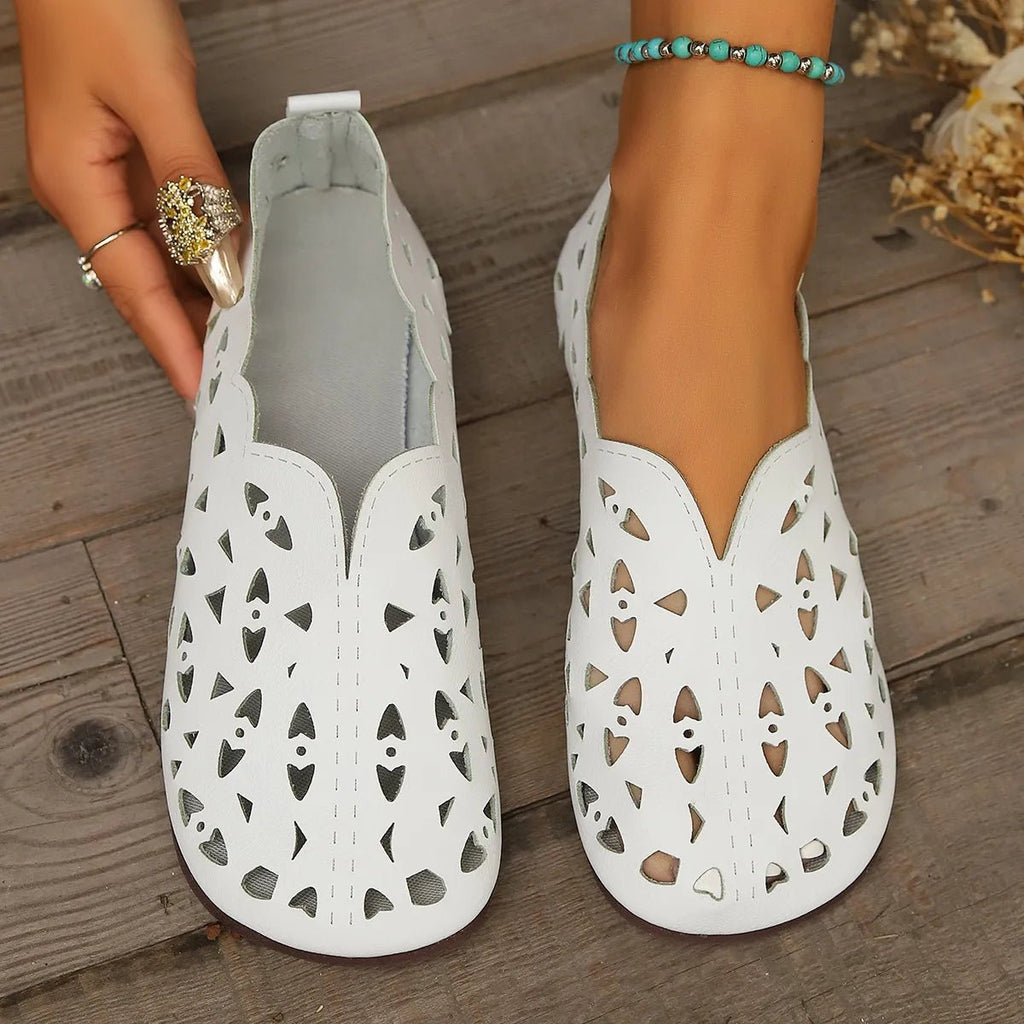 Women's hollow-out breathable casual flat slip-on shoes by Trendsi, lightweight and comfortable for everyday wear.