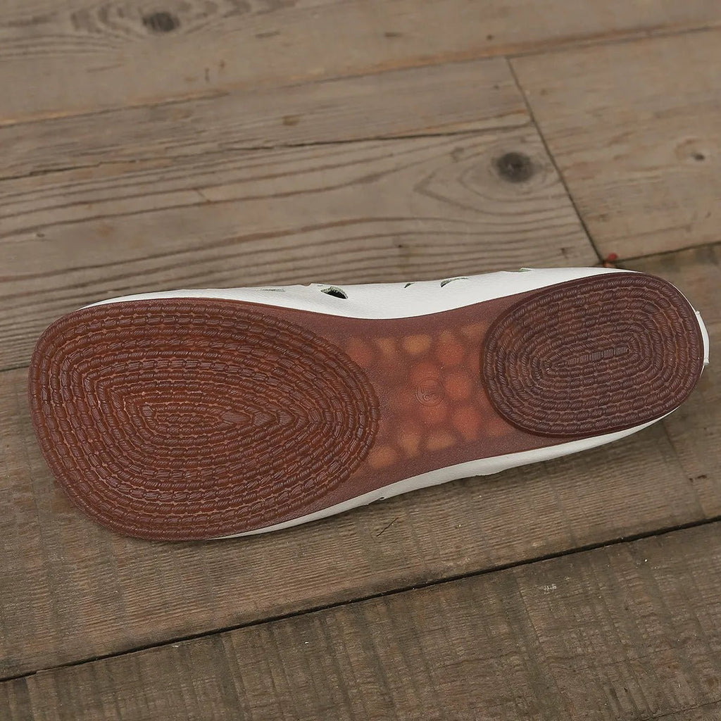 Women’s hollow-out breathable casual flat slip-on shoes by Trendsi, showcasing lightweight comfort and stylish design.
