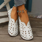 Women's hollow-out breathable casual flat slip-on shoes by Trendsi, featuring lightweight comfort and stylish open design.