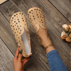Women's hollow-out breathable casual flat slip-on shoes by Trendsi, featuring lightweight design and comfortable fit.