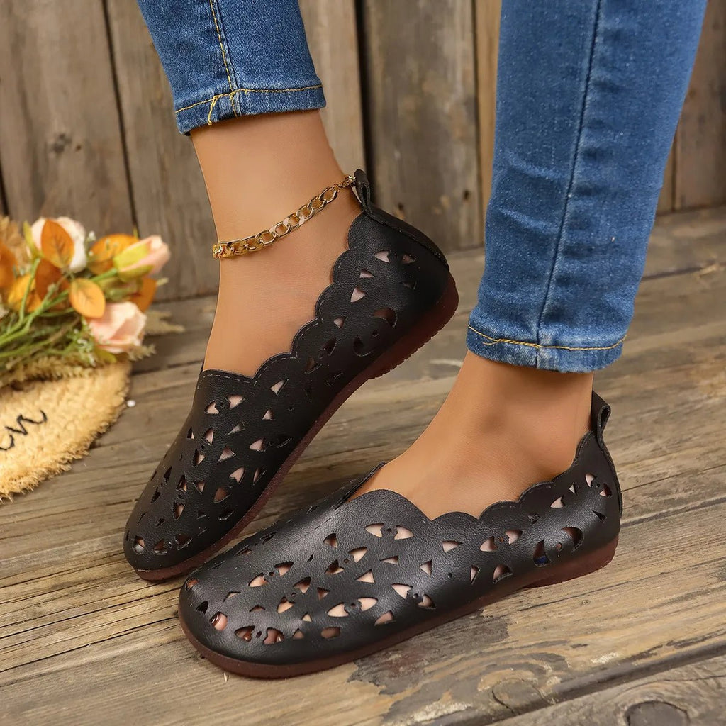 Women's breathable hollow-out casual flat slip-on shoes by Trendsi, lightweight and comfortable for everyday wear.