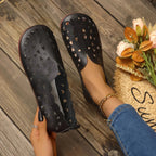 Women's hollow-out breathable casual flat slip-on shoes by Trendsi, showing lightweight design and comfortable slip-on style.