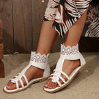 Women's open toe flat sandals with lace detail, comfortable summer footwear from Trendsi featuring elegant design and breathable style.