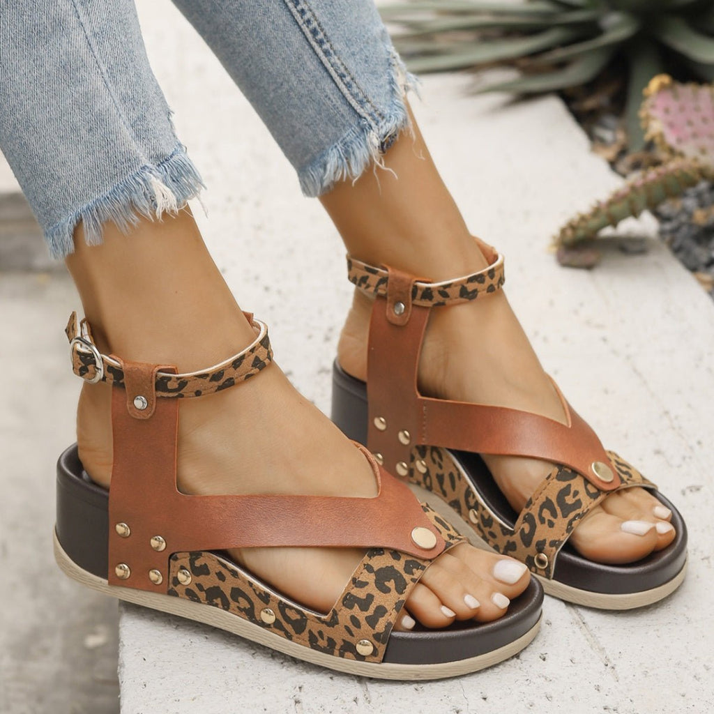 Women's leopard print ankle strap wedge sandals by Trendsi, featuring comfortable summer footwear with stylish animal print design.