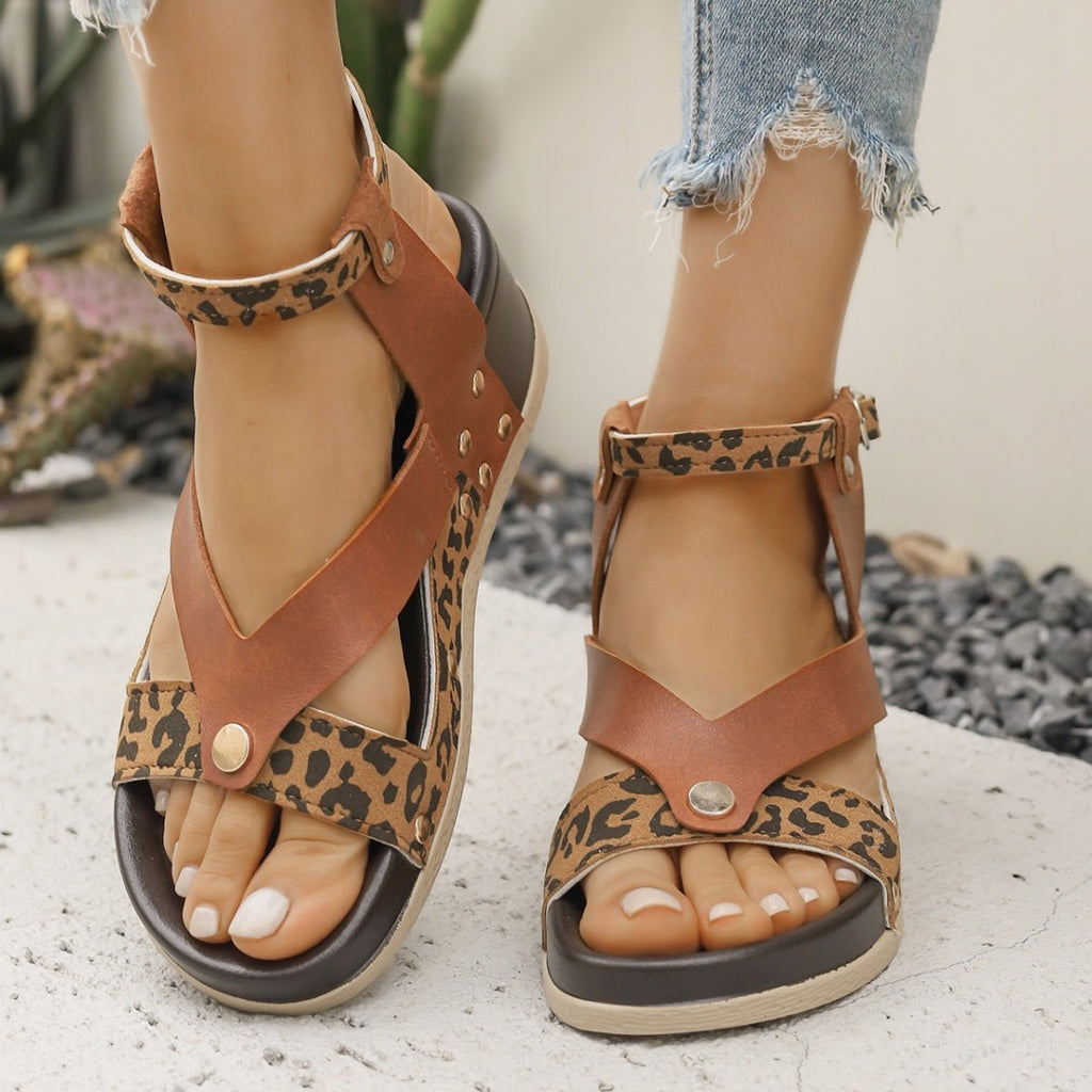 Women's leopard print ankle strap wedge sandals by Trendsi, featuring comfortable summer footwear with stylish animal print design.