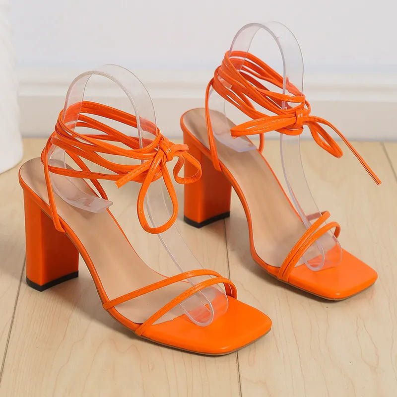 Women's open toe block heel sandals with mid-height faux leather heels, stylish and comfortable for casual or dressy wear.