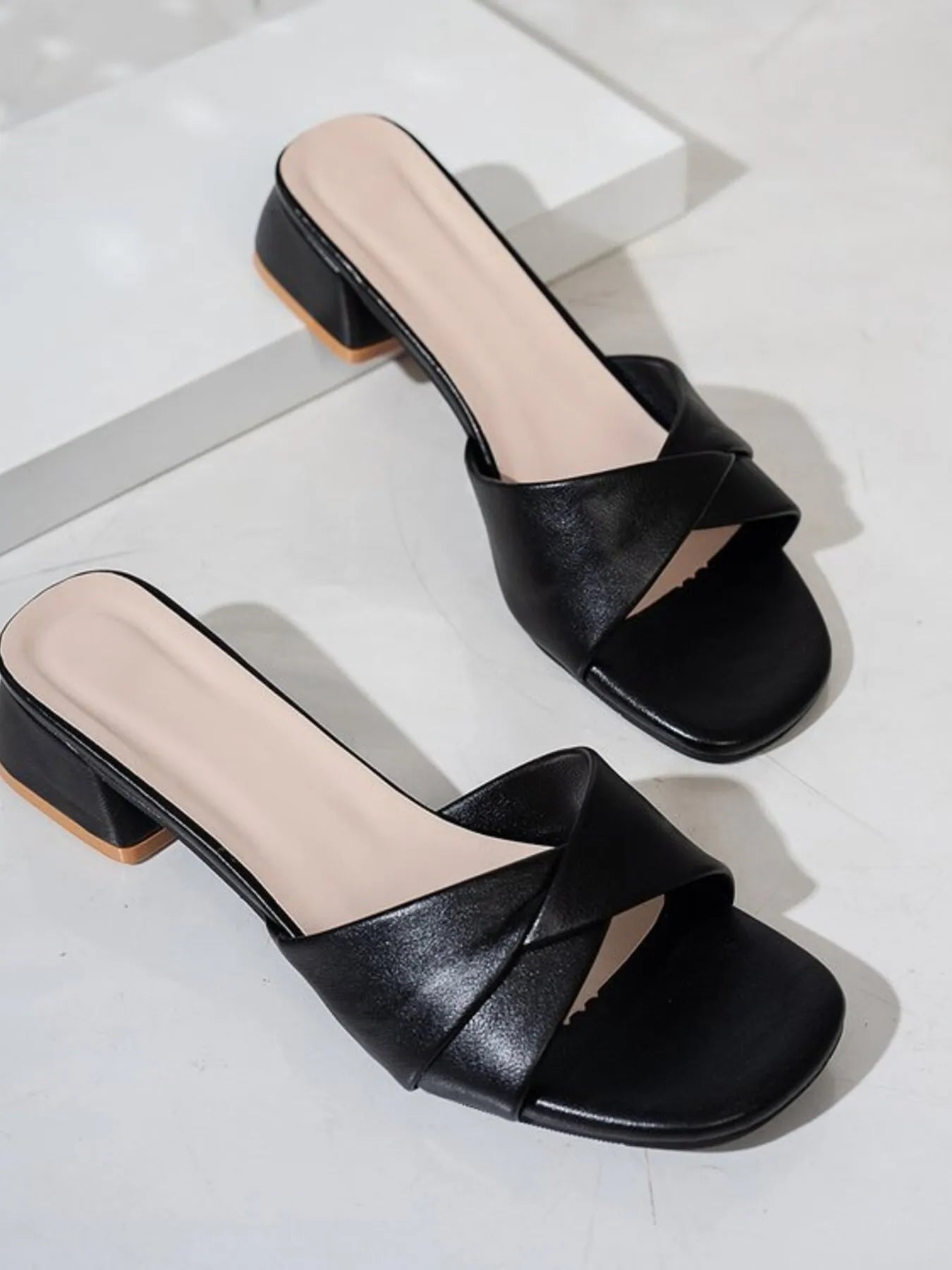 Women's open toe block heel sandals by Trendsi featuring stylish faux leather straps and comfortable chunky heel.