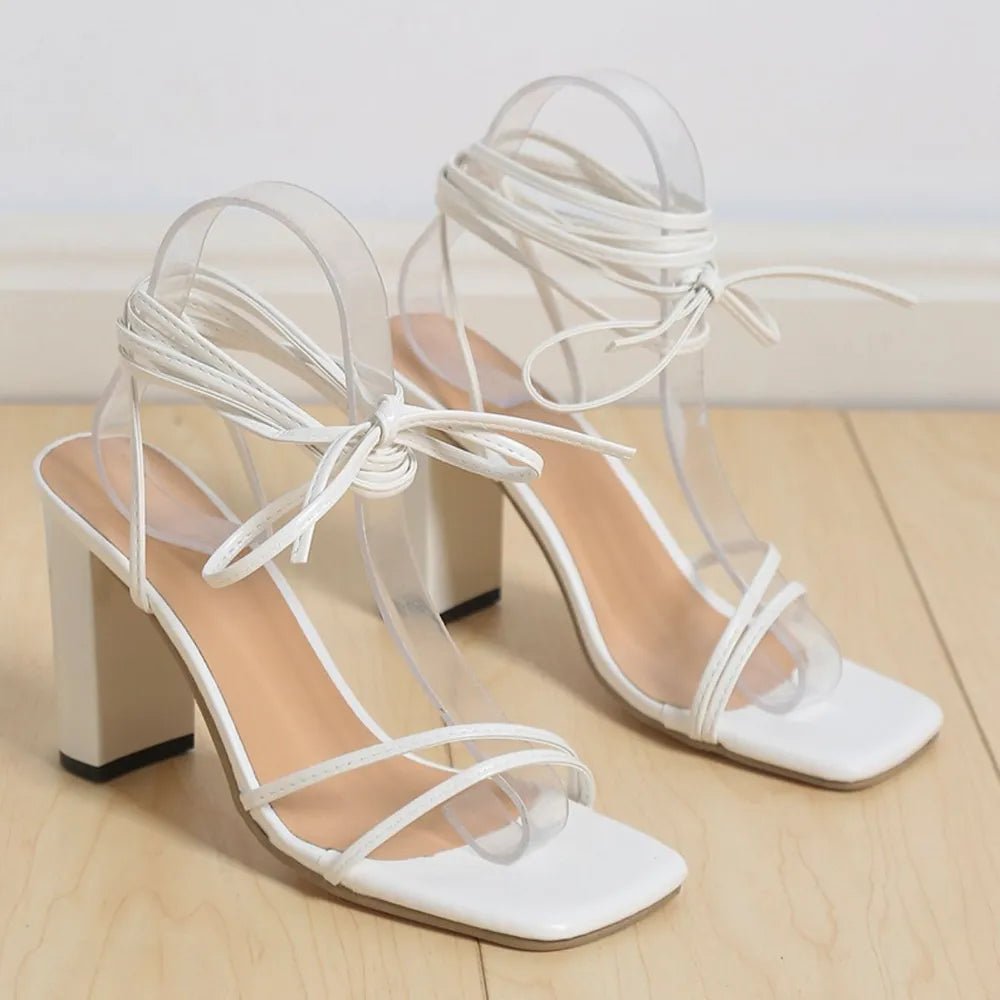 Women's open toe block heel sandals with faux leather straps, featuring a mid-height heel for stylish comfort.