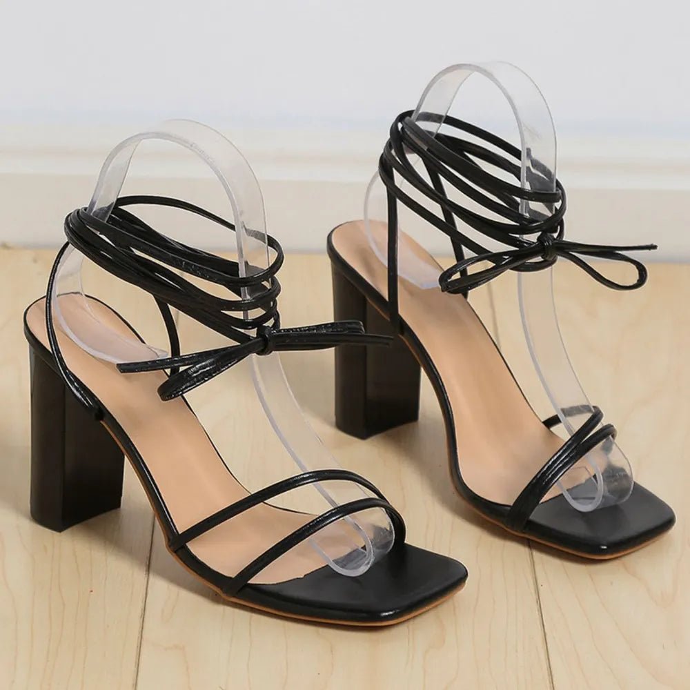 Women's open toe block heel sandals by Trendsi, featuring a comfortable mid-heel design and faux leather material.