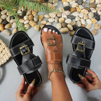 Women's brown faux leather open toe flat sandals with buckle, trendy comfortable shoes for casual wear.