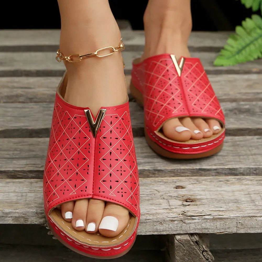 Women's open-toe faux leather flat sandals with a chic design, featuring a comfortable slip-on style for everyday wear.