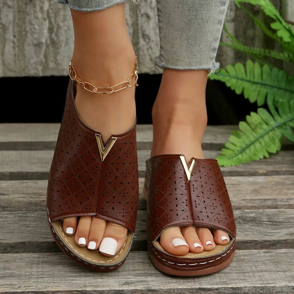 Women's open toe faux leather flat sandals in trendy style, featuring comfortable straps and a casual design for everyday wear.