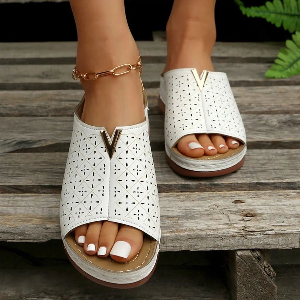 Women's open-toe faux leather flat sandals by Trendsi, featuring a chic design and comfortable fit for everyday wear.