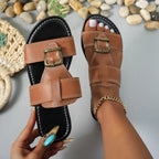 Women's brown faux leather open toe flat sandals with buckle, stylish and comfortable footwear by Trendsi.