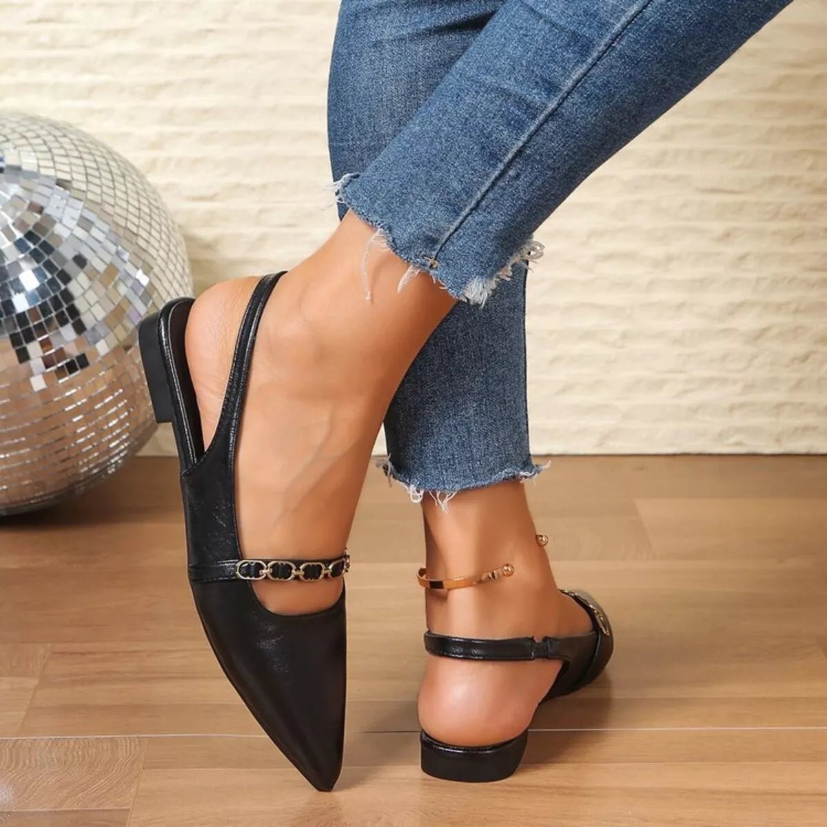 Women's pointed toe slingback sandals in faux leather with elegant design, featuring a classic silhouette and stylish heel.