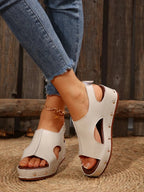 Women's studded PU leather wedge sandals featuring comfortable design, casual summer footwear with ankle straps and trendy embellishments.