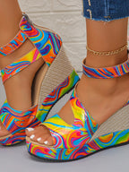 Rainbow swirl platform wedge sandals for women featuring bold high heels and colorful design by Trendsi.