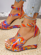 Rainbow swirl platform wedge sandals for women by Trendsi, featuring colorful high heel shoes with a stylish design and chunky sole.