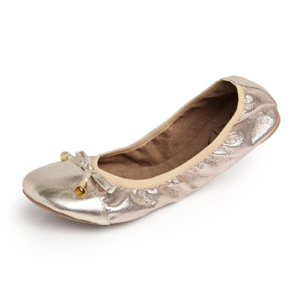 Champagne-colored metallic ballet flats with a rounded toe, a soft bow detail, and a comfortable, flexible fit.