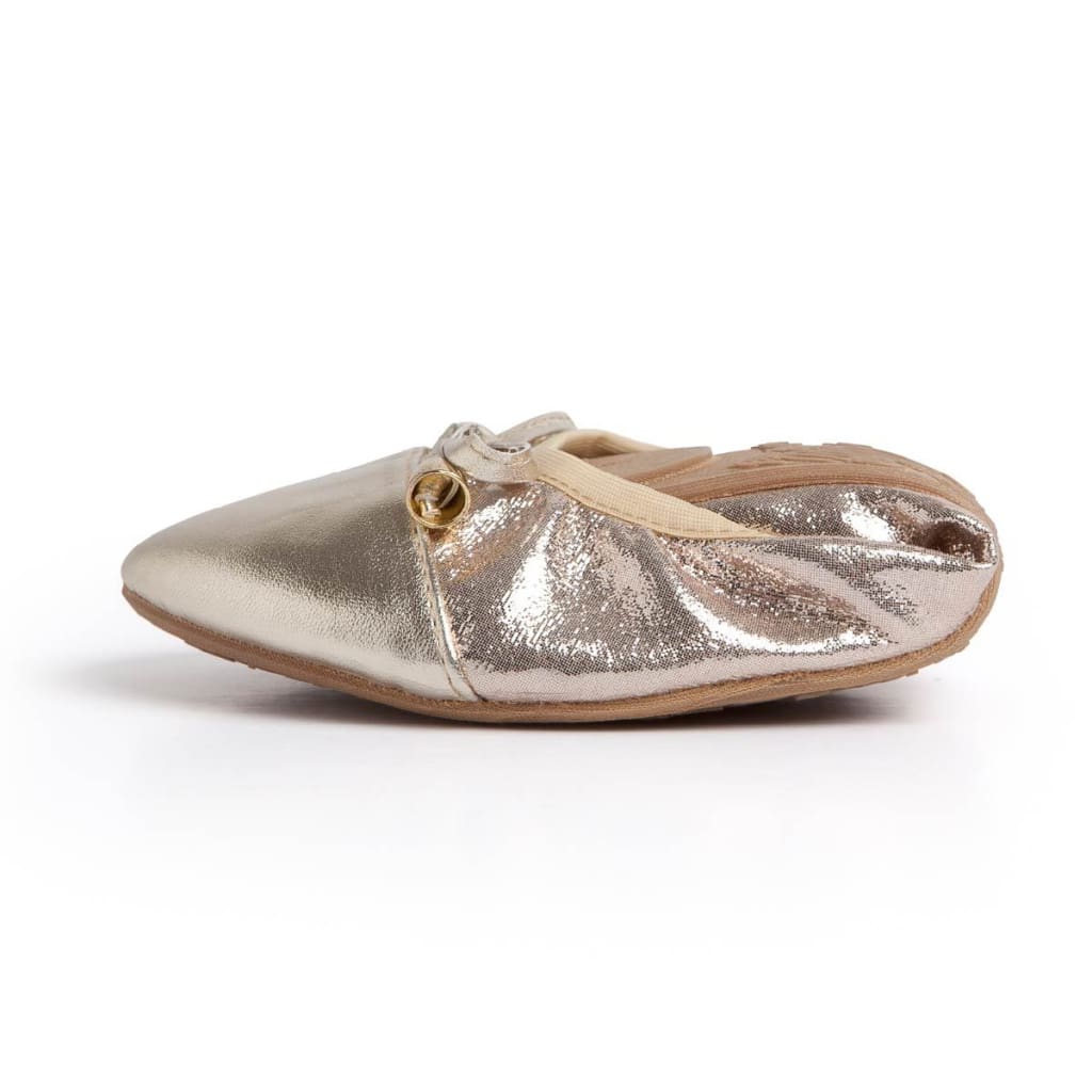 Premium champagne-colored ballet flat with a metallic finish, gathered sides, and a small gold charm detail.
