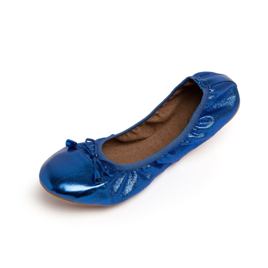 Cobalt blue metallic ballet flats with a ruched texture and a small decorative bow detail, shown against a white background.