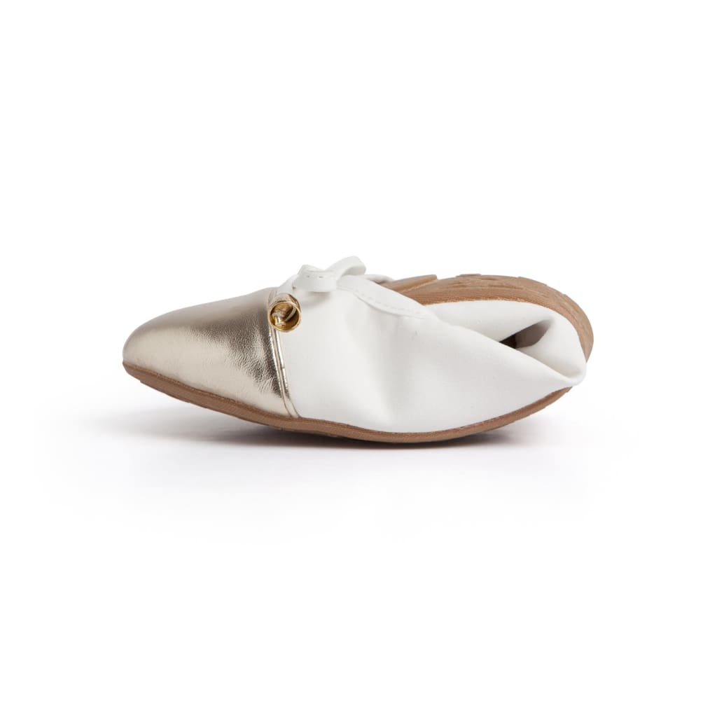 White and metallic gold foldable ballet flat with a small gold-tone metal accent, shown from a side profile.