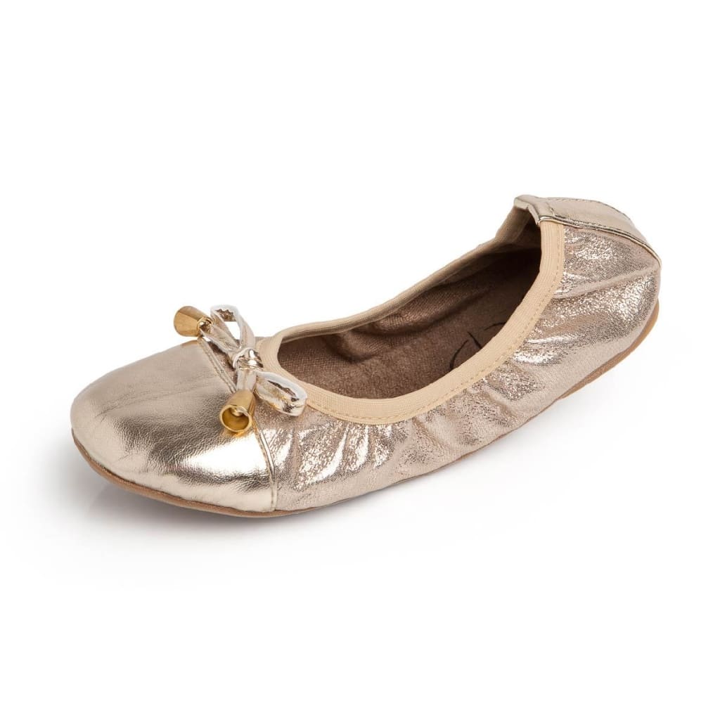Talaria Littles gold metallic ballet flat with a front bow detail and elasticized trim on a white background.