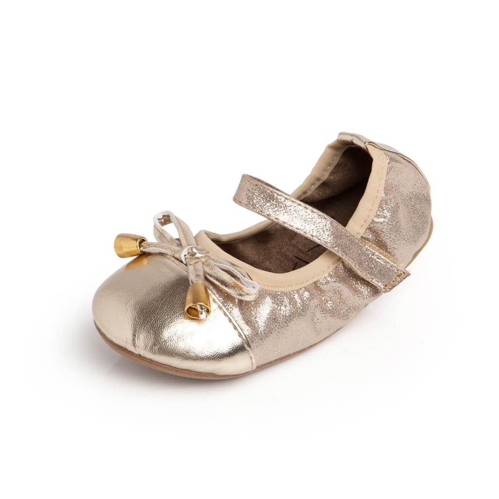 Metallic gold toddler ballet flat with velcro strap, bow detail, and gold aglets.