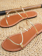 Women's strappy PU leather flat sandals with comfortable design, perfect for everyday summer wear.