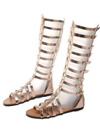 Women's strappy flat sandals with multiple buckles, made from comfortable vegan leather, perfect for casual summer wear.