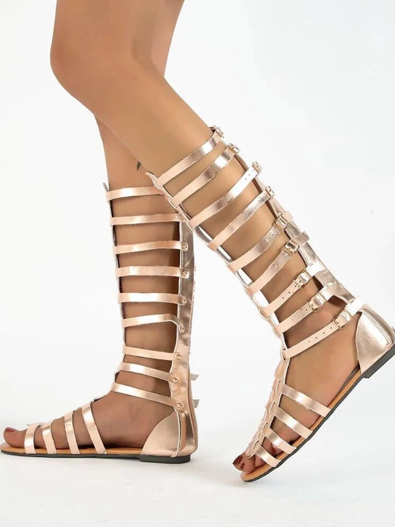 Women's strappy flat sandals with multiple buckles, made from comfortable vegan leather and designed for stylish footwear.