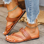 Women's minimalist toe loop flat sandals by Trendsi, featuring comfortable slip-on summer footwear with sleek design and open toe style.