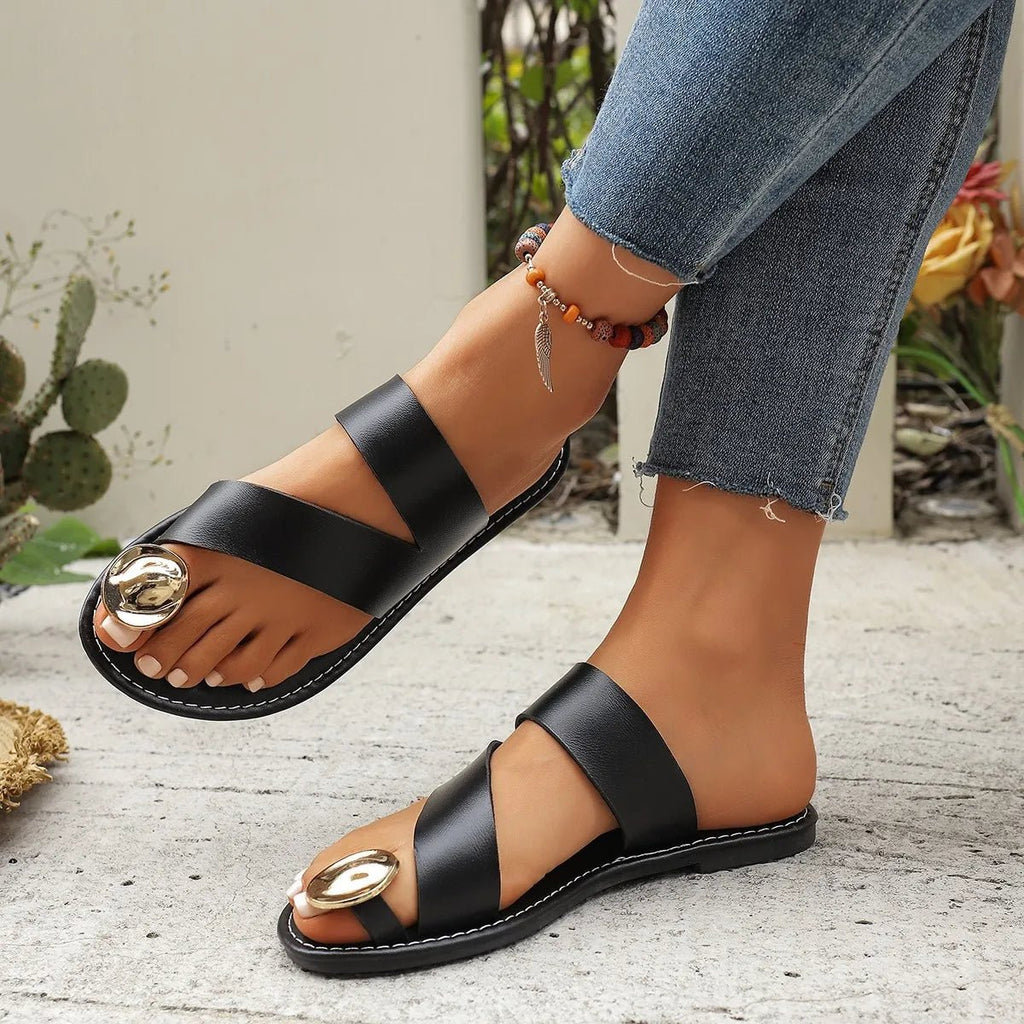 Women's minimalist PU leather toe-loop flat sandals with comfortable design, perfect for summer wear.