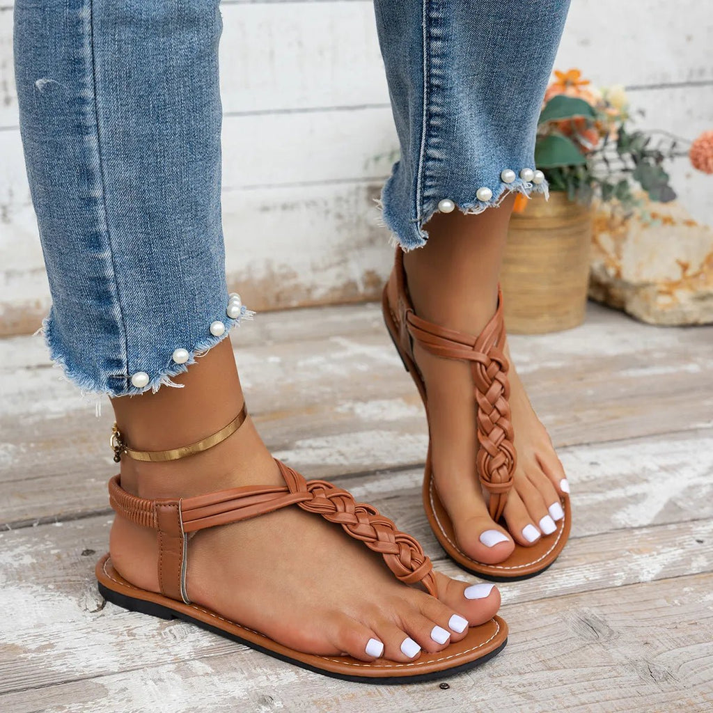 Women's chic PU leather toe post flat sandals from Trendsi, featuring a stylish design perfect for summer footwear.