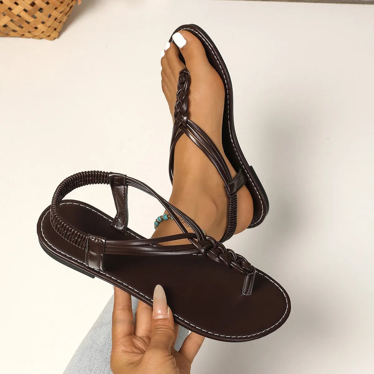Women's chic PU leather toe post flat sandals with comfortable summer design, featuring stylish straps and cushioned footbed.