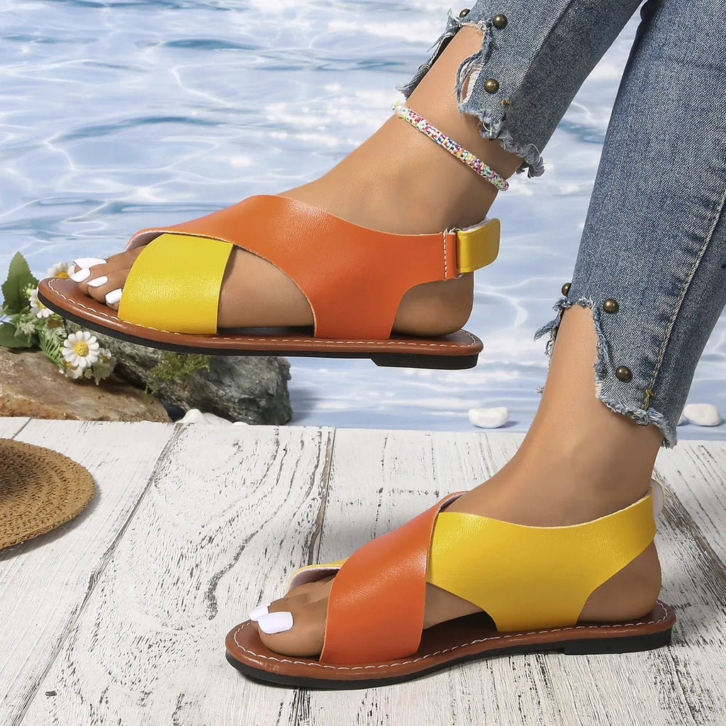 Women's two-tone crisscross strap flat sandals by Trendsi, stylish summer casual footwear with comfortable slip-on design.