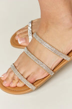 Women's rhinestone three-strap flat sandals by Trendsi, sparkly summer shoes with comfortable flat design and stylish embellishments.