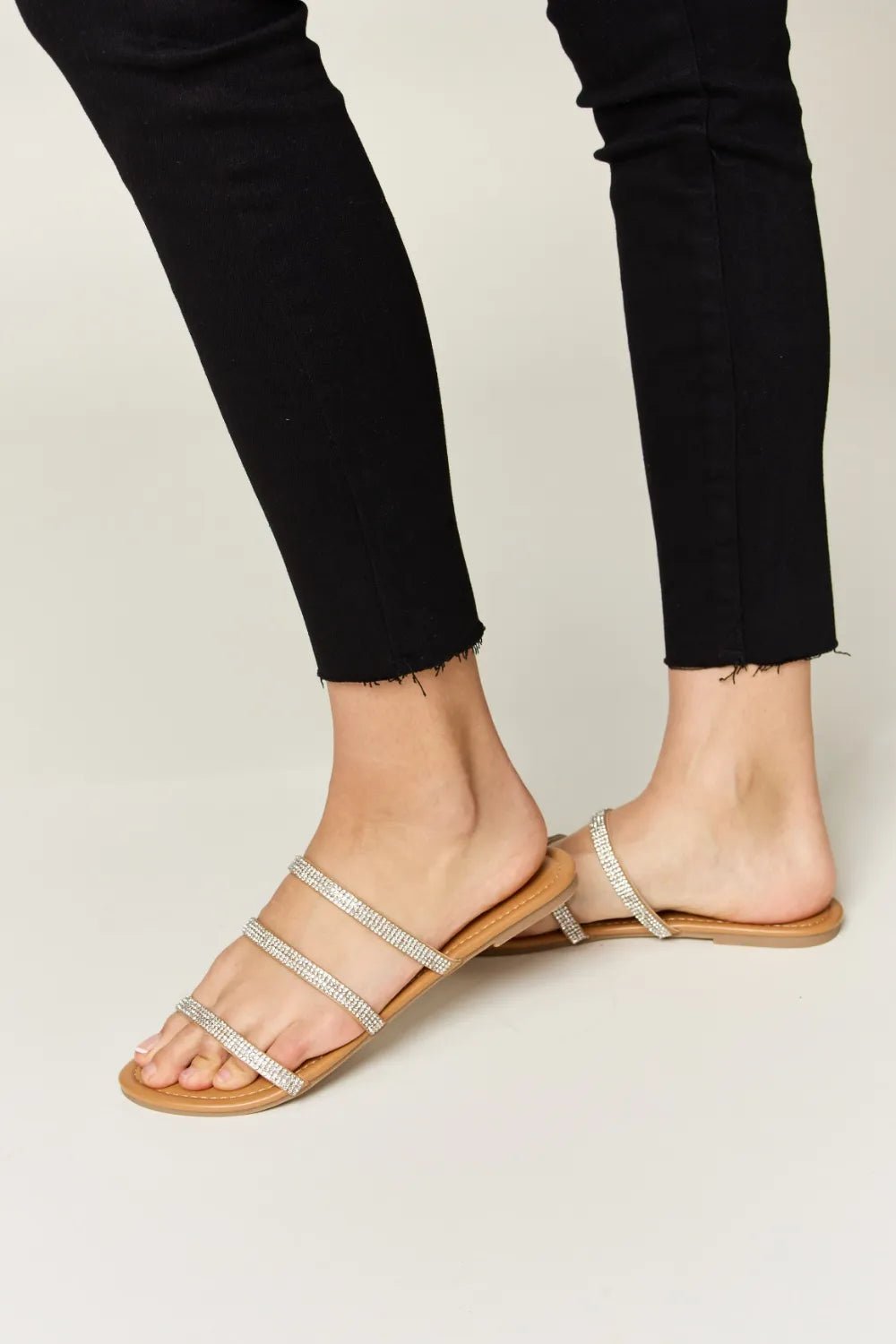 Women's rhinestone three-strap flat sandals by Trendsi, sparkly summer shoes with comfortable design and stylish embellishments.