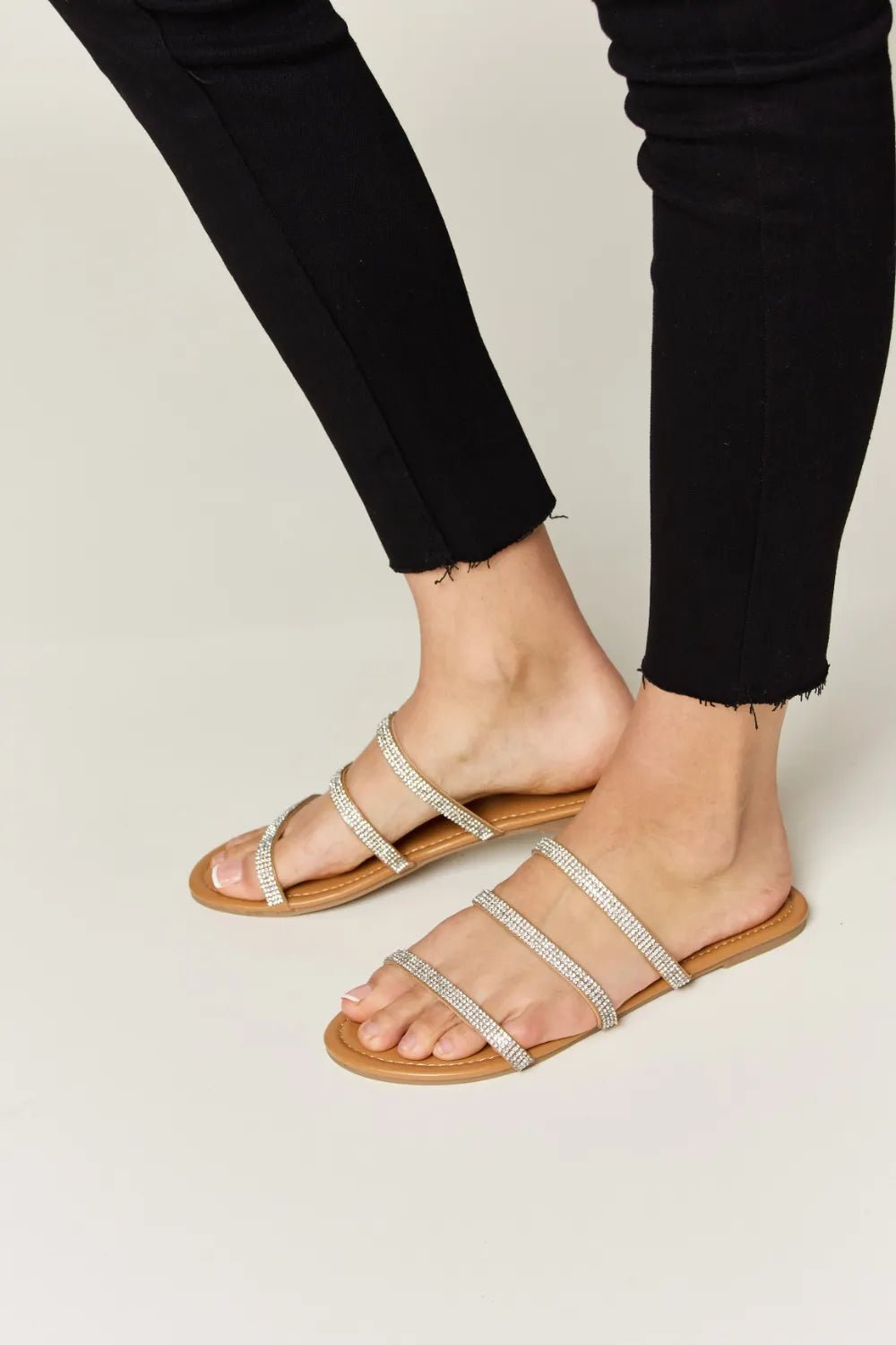 Women's rhinestone three-strap flat sandals with sparkly details, comfortable summer shoes by Trendsi.