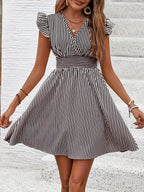Women's V-neck flutter sleeve striped mini dress by FitiqueFit, perfect for casual summer wear, featuring a stylish and comfortable design.