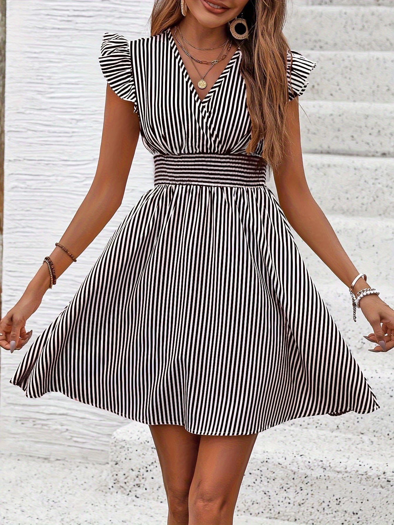 Women's V-neck flutter sleeve striped mini dress by FitiqueFit, perfect for casual summer wear, featuring a stylish and comfortable design.